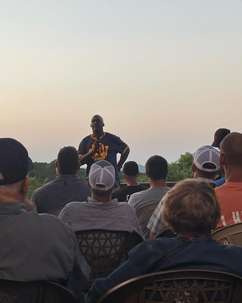 Outdoor testimony at sunset with Oak Ridge men and guests