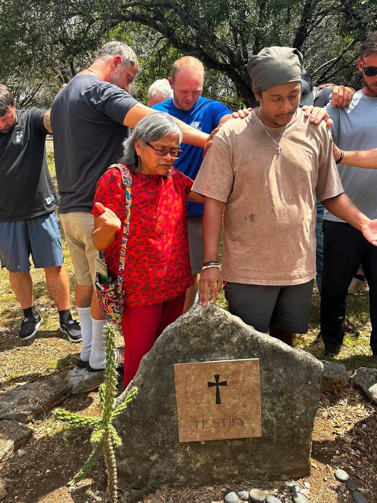 Prayer around the Testify stone with family and disciples